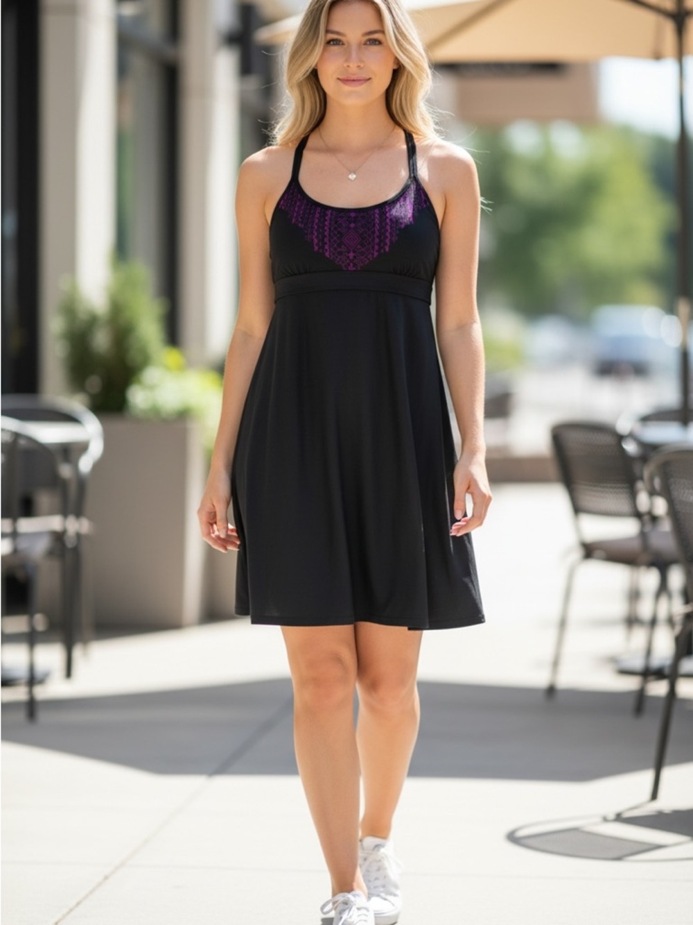 Athleta Black athletic dress with Purple Accent tights underneath